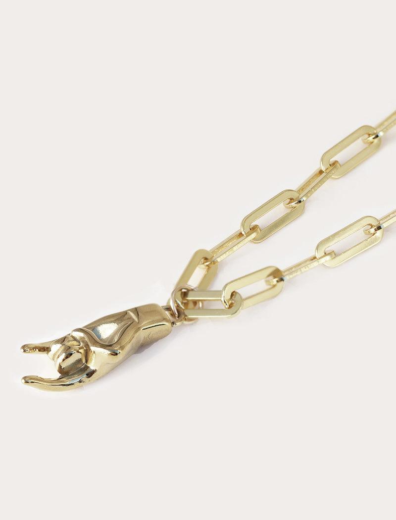 Italian Hand pendant—also known as Mano Cornuta or the “Horned Hand” amulet in silver Stainless Steel (waterproof).  Designed for everyone who values inclusivity, diversity, and meaning, it’s a timeless statement of strength and modern style. It's perfect for everyday wear. Designed by AAPI celebrity jewelry designer SONIA HOU.