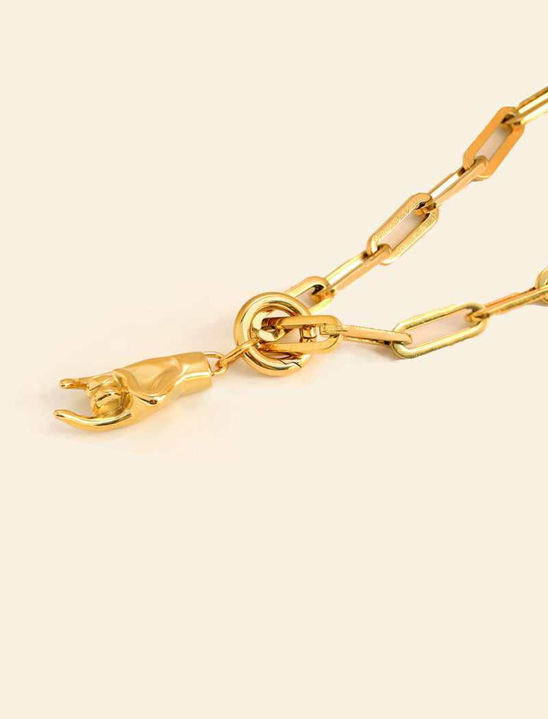 18K Gold PVD Stainless steel waterproof chain necklace with a pendant. Rooted in ancient Italian tradition, the Italian Hand — also known as Mano Cornuta or the “Horned Hand” — has long been worn as a protective amulet to ward off the Evil Eye and negative energy. Symbolizes strength, defense, and good fortune. Designed by AAPI celebrity jewelry designer SONIA HOU.

