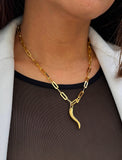 Inspired by centuries-old Italian tradition, this photo showcases a person wearing a modern chain pendant necklace with the Italian Horn —also known as the cornicello— a powerful emblem of protection, strength, and good fortune. Made of 18K Gold Vermeil (sterling silver).  Designed for everyone who values inclusivity, diversity, and meaning, it’s a timeless statement of strength and modern style. It's perfect for everyday wear. Designed by AAPI celebrity jewelry designer SONIA HOU.