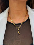 Inspired by centuries-old Italian tradition, this photo showcases a person wearing a modern chain pendant necklace with the Italian Horn —also known as the cornicello—a powerful emblem of protection, strength, and good fortune. Made of 18K Gold PVD Stainless Steel (waterproof)..  Designed for everyone who values inclusivity, diversity, and meaning, it’s a timeless statement of strength and modern style. It's perfect for everyday wear. Designed by AAPI celebrity jewelry designer SONIA HOU.