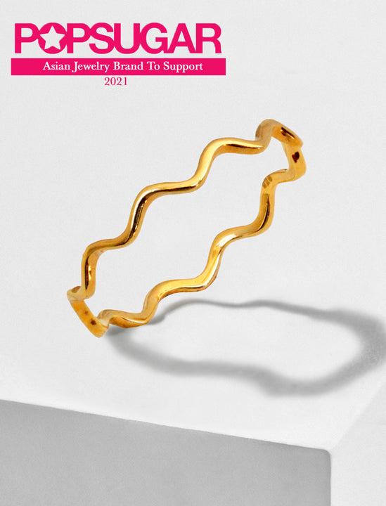 Female model wearing Asian Inspired Thin Wavy Ramen Noodle Stacking Ring in 18K Gold Vermeil with Sterling Silver base by Sonia Hou, a celebrity AAPI Chinese demi-fine jewelry designer