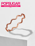 Female model wearing Asian Inspired Thin Wavy Ramen Noodle Stacking Ring in 18K Rose Gold Vermeil with Sterling Silver base by Sonia Hou, a celebrity AAPI Chinese demi-fine jewelry designer