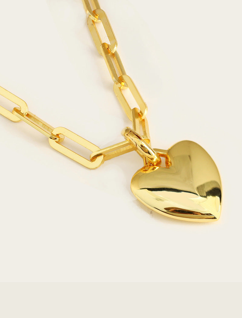 18K Gold vermeil heart-shaped pendant on a gold chain against a white background