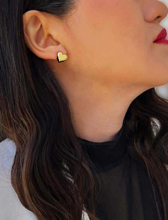 Woman wearing Puffy Heart Stud Earrings in 18K Gold Over Sterling Silver by AAPI Asian Celebrity Jewelry Designer Sonia Hou - Perfect for Valentine's Day Gift, Mother's Day, Anniversary