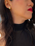 Woman wearing Puffy Heart Stud Earrings in 18K Gold Over Sterling Silver by AAPI Asian Celebrity Jewelry Designer Sonia Hou - Perfect for Valentine's Day Gift, Mother's Day, Anniversary