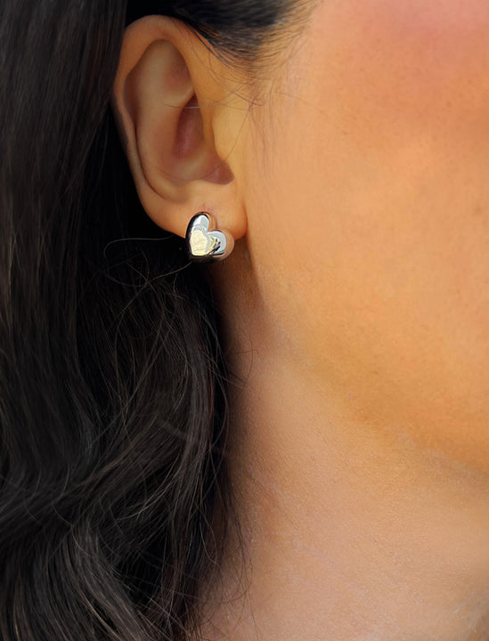 Woman wearing Puffy Heart Stud Earrings in Sterling Silver by AAPI Asian Celebrity Jewelry Designer Sonia Hou - Perfect for Valentine's Day Gift, Mother's Day, Anniversary