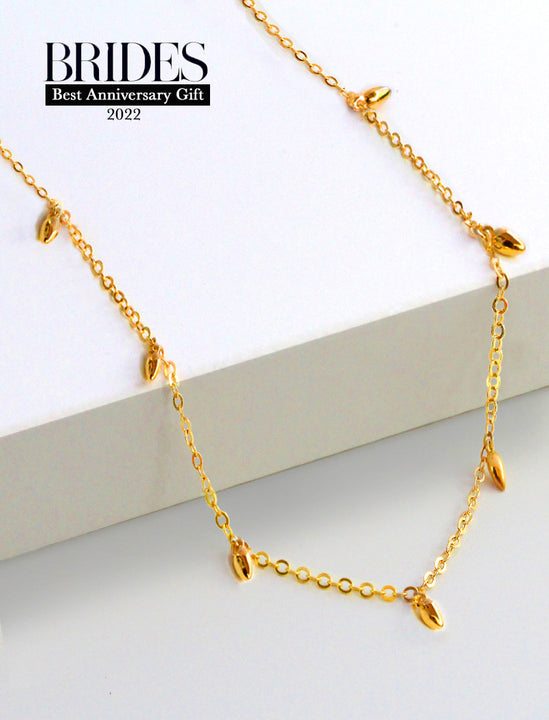 Inclusive Asian inspired thin Rice bead minimalist chain layering stacking necklace in 18K gold vermeil with a 925 sterling silver base by Sonia Hou, a celebrity Chinese AAPI demi-fine jewelry designer