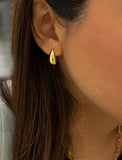 Delicately crafted from 18K gold and sterling silver, these modern Teardrop Earrings are more than a timeless accessory — they’re a symbol of strength, resilience, and beauty. The elegant teardrop shape captures life’s emotions with grace, turning a simple gesture into a statement of empowerment. Designed by AAPI celebrity jewelry designer SONIA HOU.
