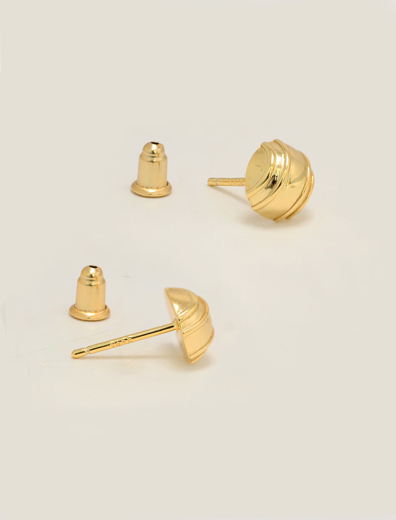 Three gold stud minimalist tennis ball earrings shown on a plain light beige background, with one earring displayed from the front and two from the side to show the post and backing by Sonia Hou, a celebrity AAPI inclusive demi-fine jewelry designer. Available in 18K Gold Over Sterling Silver, Sterling Silver and 18K Gold PVD Stainless Steel (Waterproof).