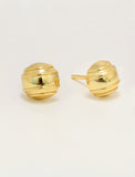 A pair of gold-colored, minimalist tennis ball stud earrings with a ribbed, textured spherical design, shown on a plain light background by Sonia Hou, a celebrity AAPI inclusive demi-fine jewelry designer. Available in 18K Gold Over Sterling Silver, Sterling Silver and 18K Gold PVD Stainless Steel (Waterproof).