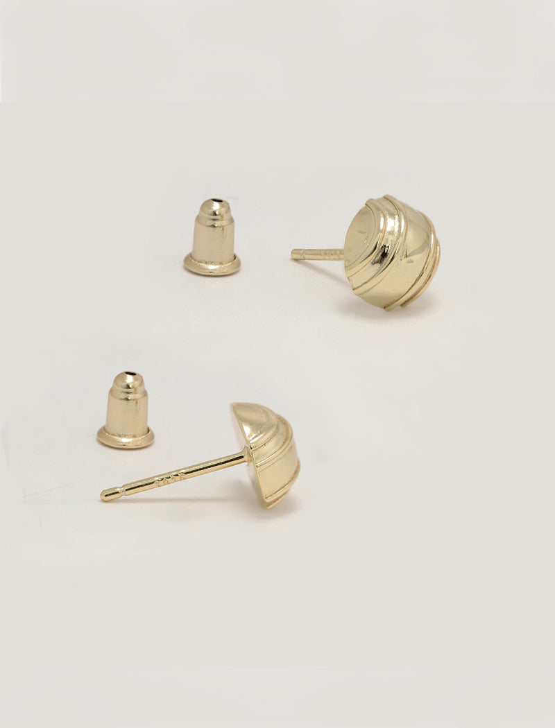Three silver-toned stud minimalist tennis ball earrings shown on a clean off-white background, with one earring displayed from the front and two from the side showing the post and backing by Sonia Hou, a celebrity AAPI inclusive demi-fine jewelry designer. Available in 18K Gold Over Sterling Silver, Sterling Silver and 18K Gold PVD Stainless Steel (Waterproof).