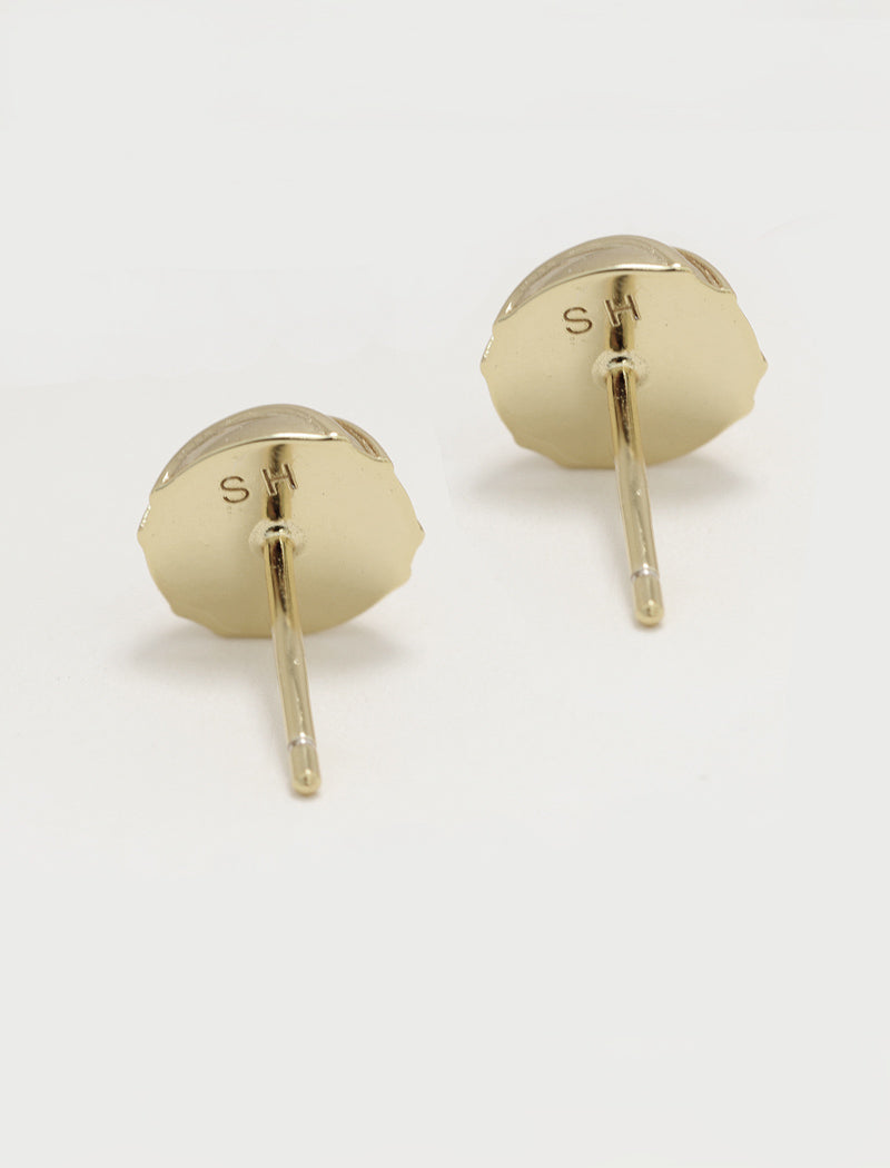 A pair of silver stud minimalist tennis ball earrings with a scalloped circular face and a straight post, shown on a clean white background by Sonia Hou, a celebrity AAPI inclusive demi-fine jewelry designer. Available in 18K Gold Over Sterling Silver, Sterling Silver and 18K Gold PVD Stainless Steel (Waterproof). The brand initials 'SH' are engraved on the back of the earrings.