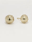 A pair of silver-toned minimalist tennis ball stud earrings with a ribbed, textured spherical design, shown on a plain light gray background by Sonia Hou, a celebrity AAPI inclusive demi-fine jewelry designer. Available in 18K Gold Over Sterling Silver, Sterling Silver and 18K Gold PVD Stainless Steel (Waterproof).