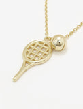 A silver tennis ball racket pendant necklace with a small silver ball charm, shown on a clean white background by Sonia Hou, a celebrity AAPI inclusive demi-fine jewelry designer. Available in 18K Gold Over Sterling Silver, Sterling Silver and 18K Gold PVD Stainless Steel (Waterproof).