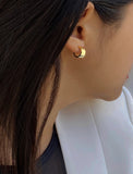 Female model wearing BOSS 18K GOLD VERMEIL OVER STERLING SILVER MINIMALIST CHUBBY MINI SMALL ROUND HOOP EARRINGS by Sonia Hou Jewelry