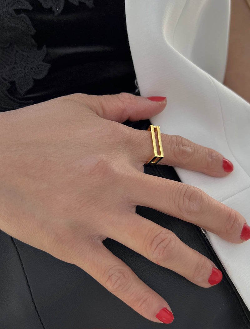 Female model wearing C.E.O. BOLD THICK GEOMETRIC RECTANGULAR RING IN 18K GOLD VERMEIL OVER STERLING SILVER BY SONIA HOU JEWELRY