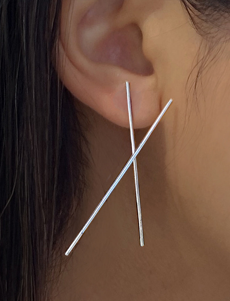 Female model wearing Asian Inspired Chopsticks Minimalist Long Thin Dangle Earrings in 925 Sterling Silver by Sonia Hou, a celebrity AAPI demi-fine jewelry designer