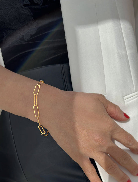 Female Model wearing Essential Minimalist Large Bold Thick Chunky Link Chain Paperclip Layering Stacking Statement Bracelet in 18K Gold Vermeil With Sterling Silver base by Sonia Hou, a celebrity Chinese AAPI demi-fine jewelry designer