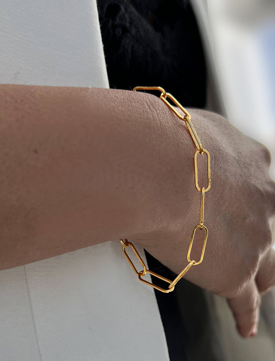 Female model wearing ESSENTIAL LARGE PAPERCLIP LINK CHAIN BRACELET IN 18K GOLD VERMEIL by SONIA HOU Jewelry