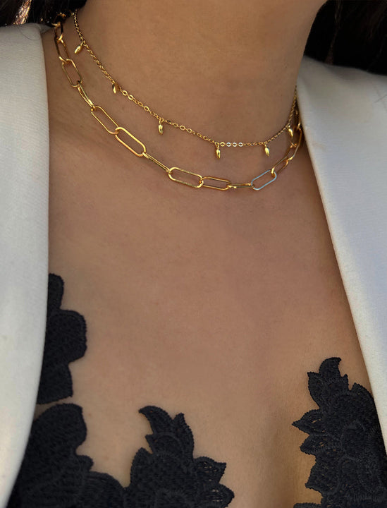 Female model wearing inclusive Asian inspired thin Rice bead minimalist chain layering stacking necklace in 18K gold vermeil with a 925 sterling silver base by Sonia Hou, a celebrity Chinese AAPI demi-fine jewelry designer