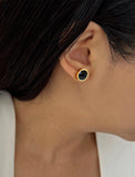 Female model wearing luxe minimalist small or big FIRE 3-Way Convertible Black Onyx Gemstone Round Stud earrings in 24K Gold by Sonia Hou, a celebrity AAPI Asian Chinese demi-fine fashion costume jewelry designer. 
