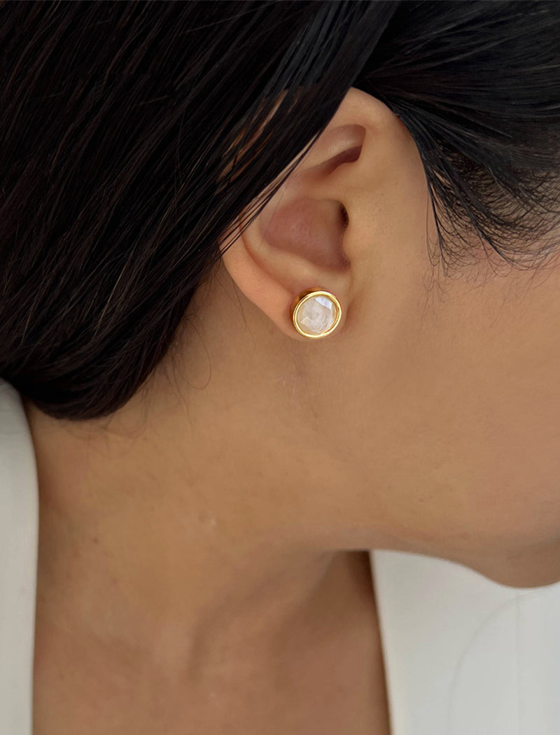 Female model wearing luxe minimalist small or big FIRE 3-Way Convertible White Quartz Gemstone Round Stud earrings in 24K Gold by Sonia Hou, a celebrity AAPI Asian Chinese demi-fine fashion costume jewelry designer. 