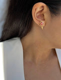 Woman model wearing luxe minimalist small or big FIRE 3-Way Convertible Geometric Pink Coral Gemstone Round Stud Triangle Spike Earring Jackets in 24K Gold by Sonia Hou, a celebrity AAPI Chinese demi-fine fashion costume jewelry designer. Actress Jessica Alba wore these similar modern spike ear jackets.