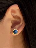 Woman model wearing luxe minimalist small or big FIRE 3-Way Convertible Geometric Blue Denim Lapis Lazuli Gemstone Round Stud Triangle Spike Earring Jackets in 24K Gold by Sonia Hou, a celebrity AAPI Chinese demi-fine fashion costume jewelry designer. Actress Jessica Alba wore these similar modern spike ear jackets.