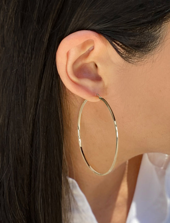 Female model wearing Eternity Sterling Silver Hoop Earrings by Sonia Hou Jewelry