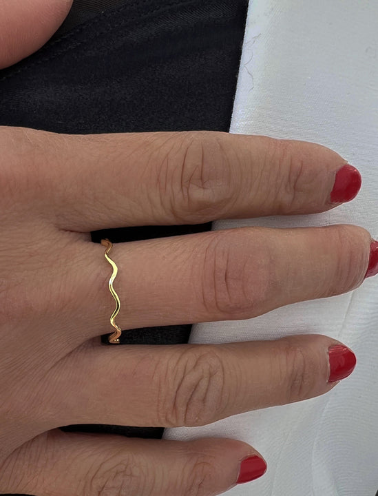 Female model wearing Thin Wavy Noodle Ring in 18K Gold Vermeil by Sonia Hou Jewelry
