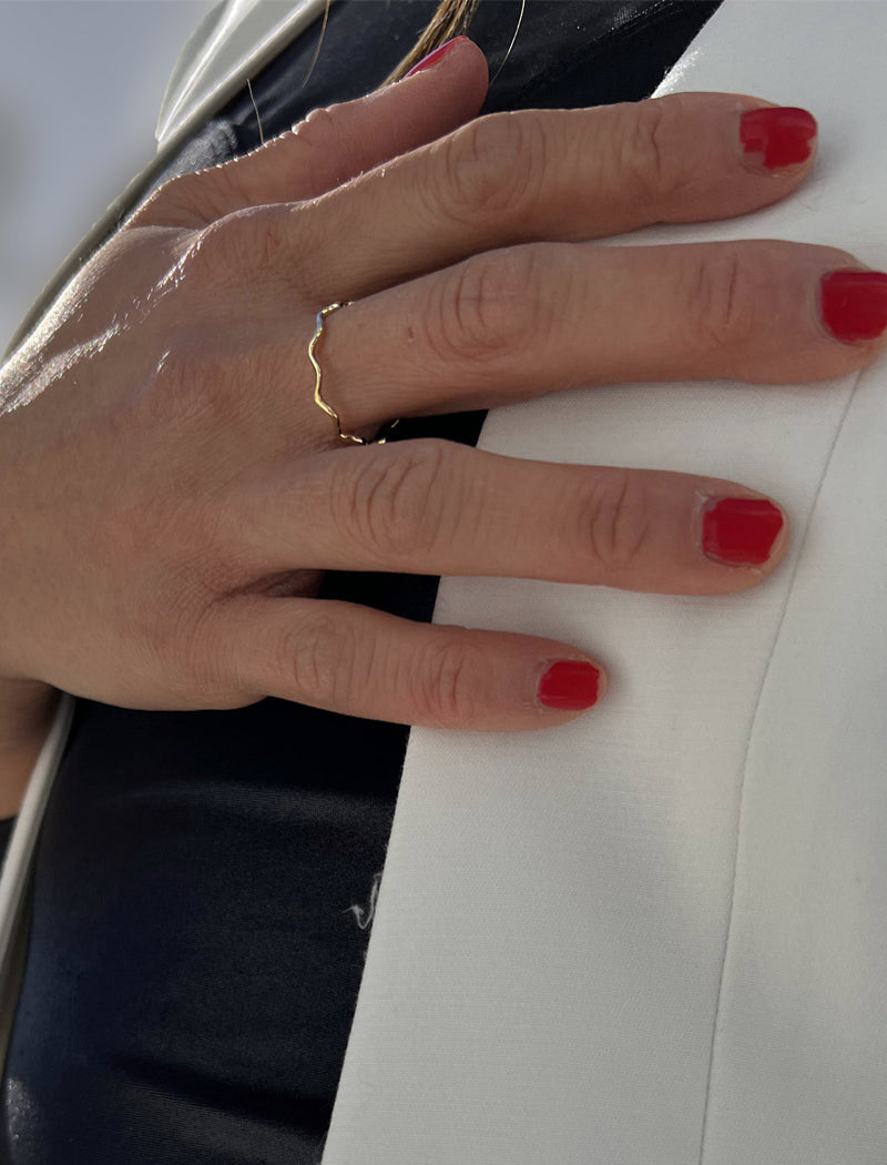 Female model wearing Asian Inspired Thin Wavy Ramen Noodle Stacking Ring in 18K Gold Vermeil with Sterling Silver base by Sonia Hou, a celebrity AAPI Chinese demi-fine jewelry designer
