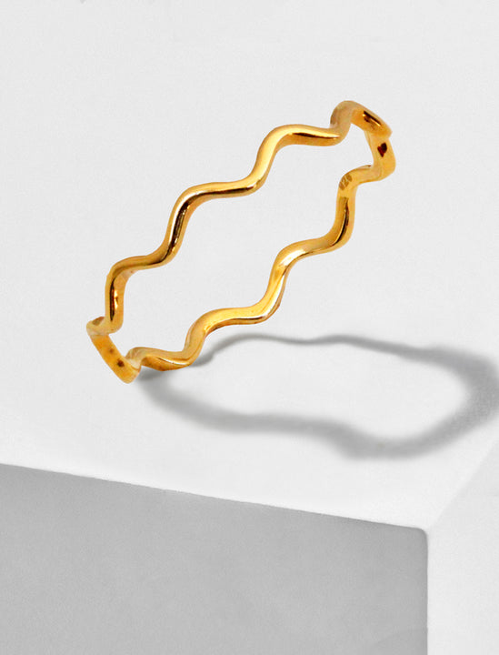 Female model wearing Asian Inspired Thin Wavy Ramen Noodle Stacking Ring in 18K Gold Vermeil with Sterling Silver base by Sonia Hou, a celebrity AAPI Chinese demi-fine jewelry designer