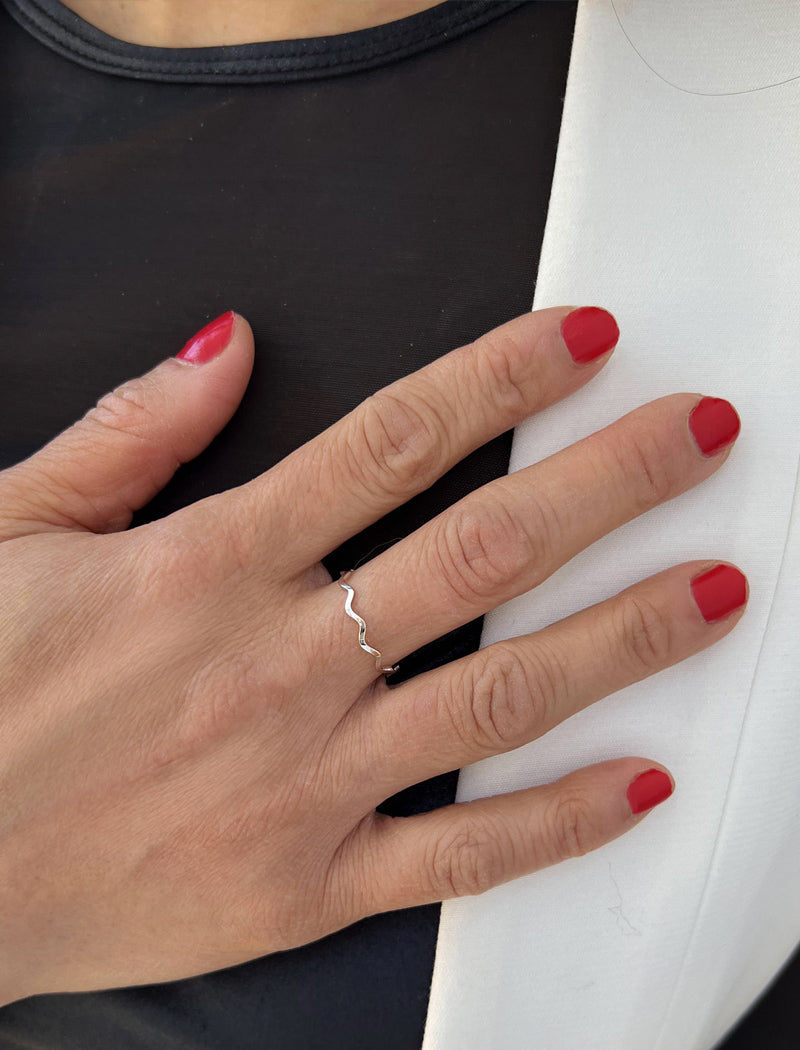 Female model wearing Asian Inspired Thin Wavy Ramen Noodle Stacking Ring in 925 Sterling Silver base by Sonia Hou, a celebrity AAPI Chinese demi-fine jewelry designer