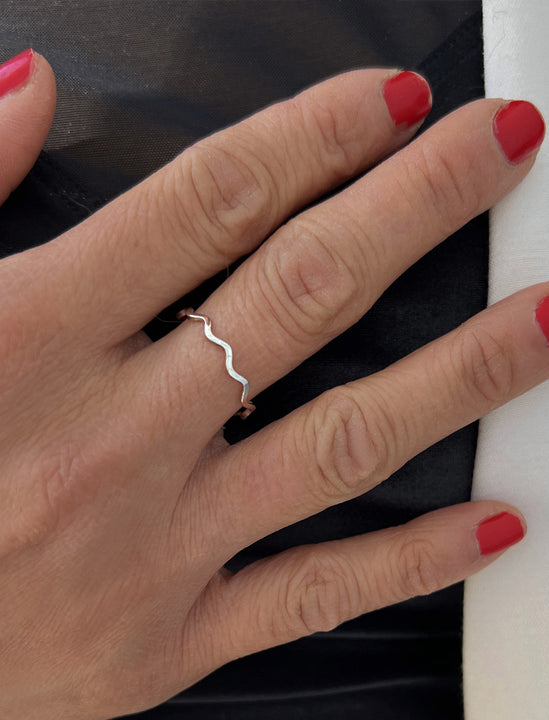 Female model wearing Asian Inspired Thin Wavy Ramen Noodle Stacking Ring in 925 Sterling Silver base by Sonia Hou, a celebrity AAPI Chinese demi-fine jewelry designer