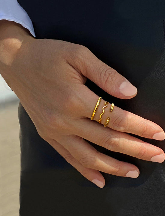 Female model wearing Asian Inspired Thin Wavy Ramen Noodle Stacking Ring in 18K Gold Vermeil with Sterling Silver base by Sonia Hou, a celebrity AAPI Chinese demi-fine jewelry designer