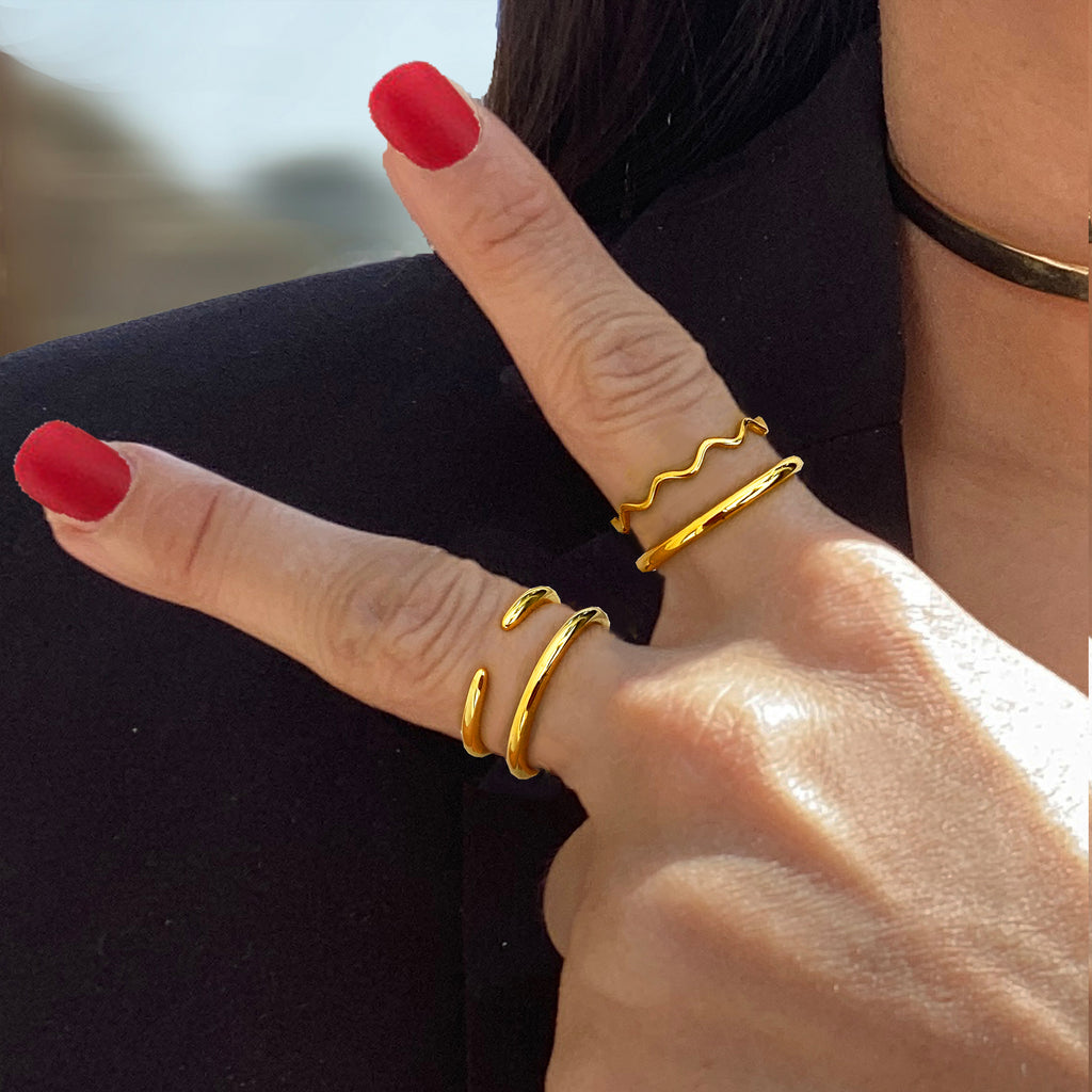 Female model wearing Asian Inspired Thin Wavy Ramen Noodle Stacking Ring in 18K Gold Vermeil with Sterling Silver base by Sonia Hou, a celebrity AAPI Chinese demi-fine jewelry designer