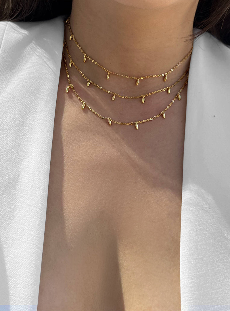 Female model wearing inclusive Asian Inspired Thin Rice Bead Minimalist Chain Layering Stacking Necklace in 18K Gold Vermeil With Sterling Silver base by Sonia Hou, a celebrity AAPI Chinese demi-fine jewelry designer