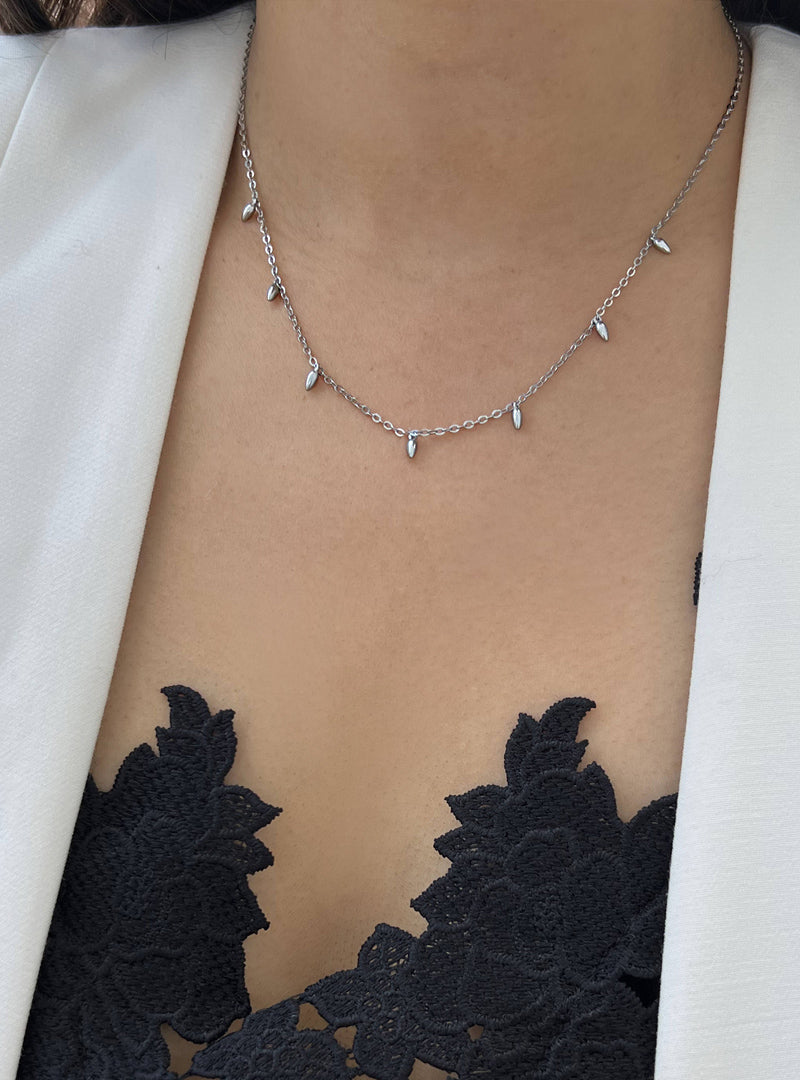 Female model wearing inclusive Asian inspired thin Rice bead minimalist chain layering stacking necklace in 925 sterling silver by Sonia Hou, a celebrity Chinese AAPI demi-fine jewelry designer