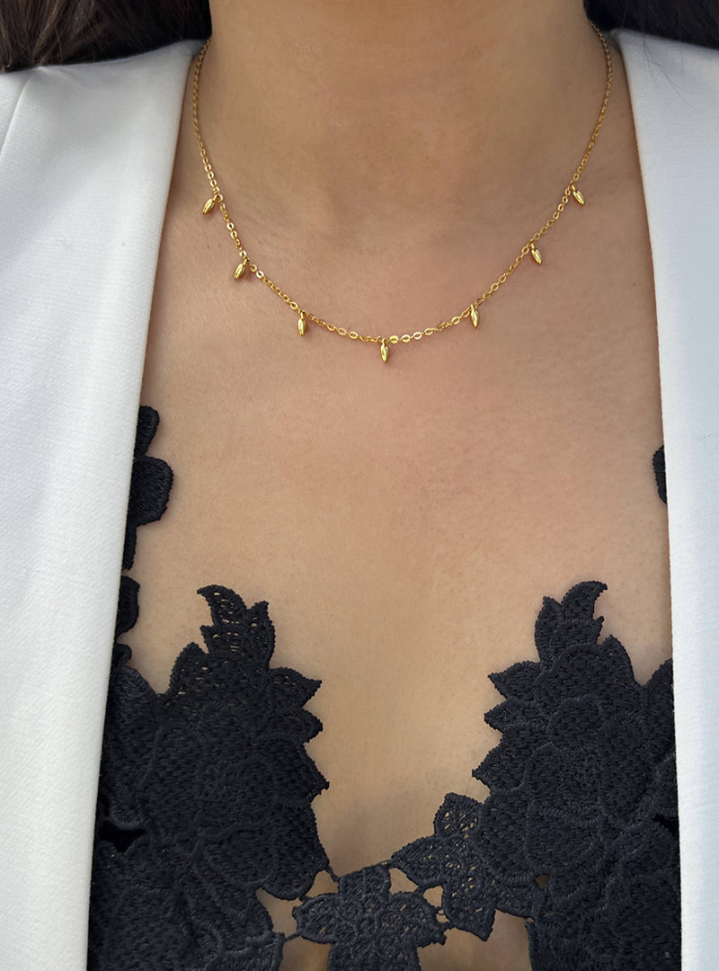 Female model wearing inclusive Asian inspired thin Rice bead minimalist chain layering stacking necklace in 18K gold vermeil with sterling silver base by Sonia Hou, a celebrity Chinese AAPI demi-fine jewelry designer