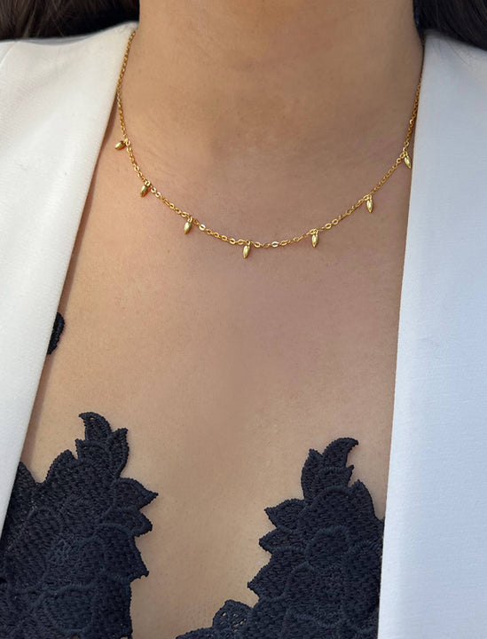 Female model wearing inclusive Asian Inspired Thin Rice Bead Minimalist Chain Layering Stacking Necklace in 18K Gold Vermeil With Sterling Silver base by Sonia Hou, a celebrity AAPI Chinese demi-fine jewelry designer