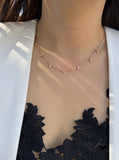 Woman wearing thin RICE Minimalist Necklace in 18K Rose Gold Vermeil by Sonia Hou Jewelry 
