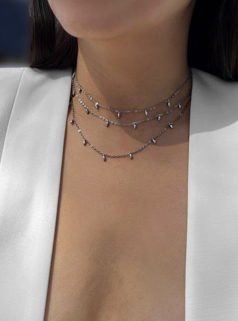 Female model wearing Inclusive Asian inspired thin Rice bead minimalist chain layering stacking necklace in 925 sterling silver base by Sonia Hou, a celebrity Chinese AAPI demi-fine jewelry designer