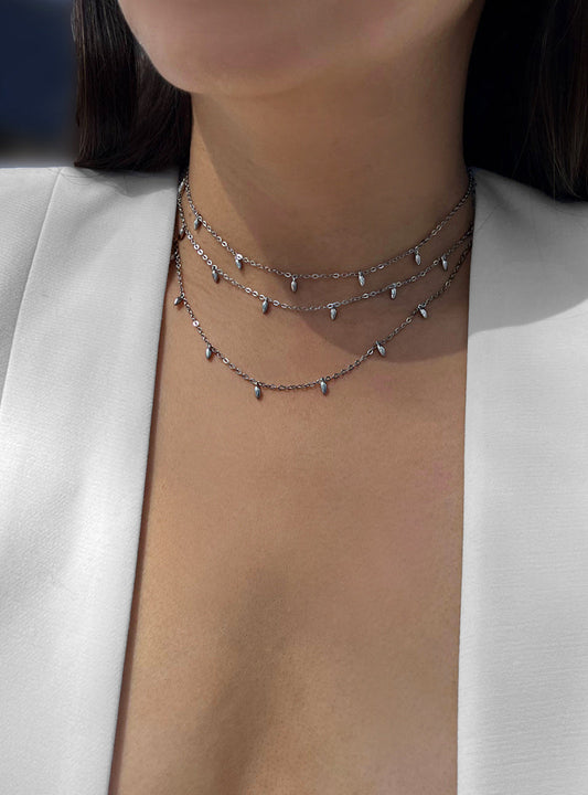 Female model wearing inclusive Asian inspired thin Rice bead minimalist chain layering stacking necklace in 925 sterling silver by Sonia Hou, a celebrity Chinese AAPI demi-fine jewelry designer