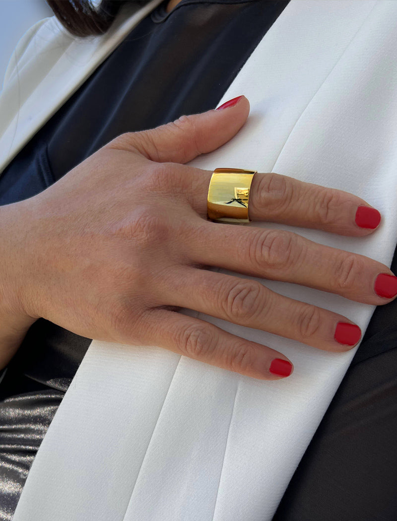 Female model wearing wide RICH thick bold chunky statement cigar band ring in 18K gold vermeil with a 925 sterling silver base by Sonia Hou, a celebrity AAPI Chinese demi-fine jewelry designer