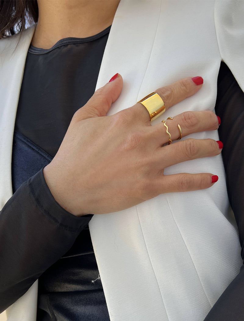 Female model wearing stacking Thin Wavy Noodle Ring in 18K Gold Vermeil by Sonia Hou Jewelry
