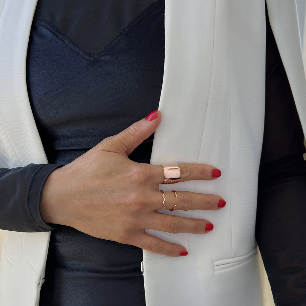 Female model wearing Asian Inspired Thin Wavy Ramen Noodle Stacking Ring in 18K Rose Gold Vermeil with Sterling Silver base by Sonia Hou, a celebrity AAPI Chinese demi-fine jewelry designer