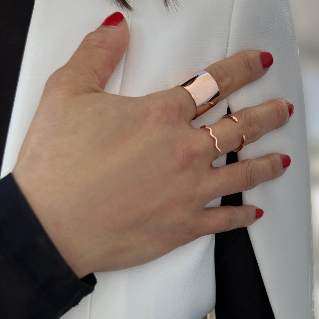 Female model wearing Asian Inspired Thin Wavy Ramen Noodle Stacking Ring in 18K Rose Gold Vermeil with Sterling Silver base by Sonia Hou, a celebrity AAPI Chinese demi-fine jewelry designer