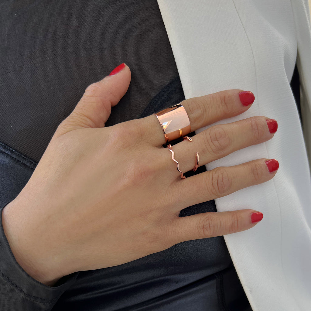 Female model wearing Asian Inspired Thin Wavy Ramen Noodle Stacking Ring in 18K Rose Gold Vermeil with Sterling Silver base by Sonia Hou, a celebrity AAPI Chinese demi-fine jewelry designer
