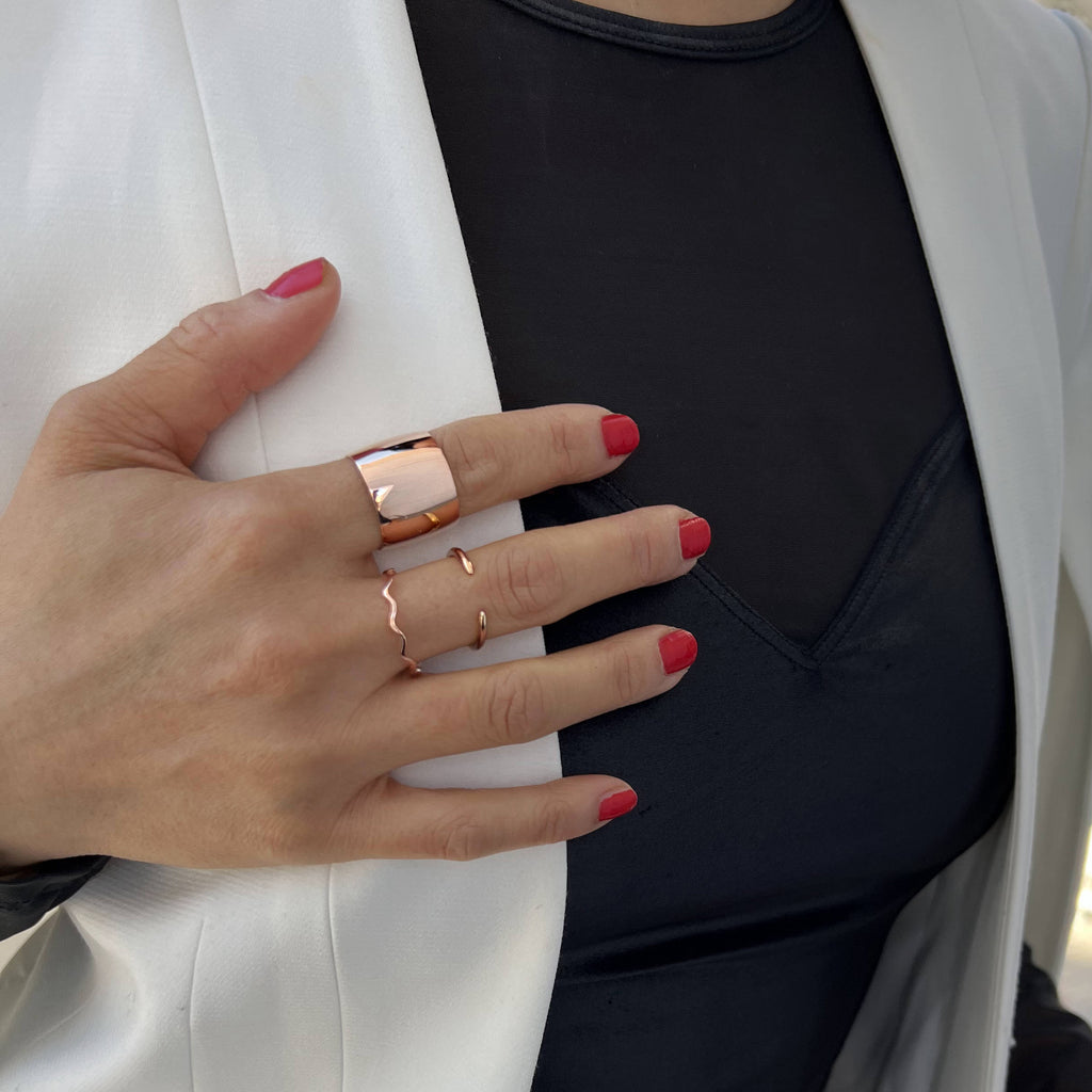 Female model wearing Asian Inspired Thin Wavy Ramen Noodle Stacking Ring in 18K Rose Gold Vermeil with Sterling Silver base by Sonia Hou, a celebrity AAPI Chinese demi-fine jewelry designer