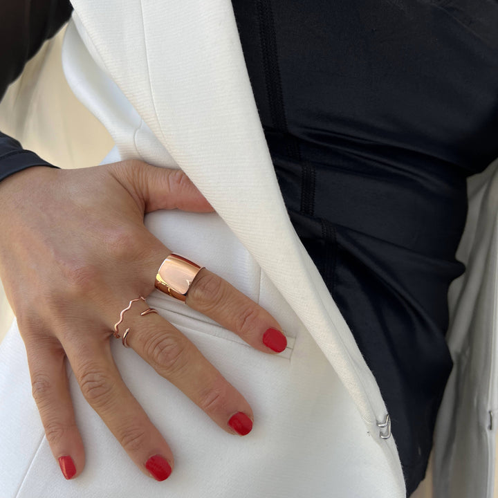 Female model wearing Asian Inspired Thin Wavy Ramen Noodle Stacking Ring in 18K Rose Gold Vermeil with Sterling Silver base by Sonia Hou, a celebrity AAPI Chinese demi-fine jewelry designer